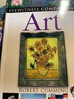 Front cover of 'Art' book by Robert Cumming, showing sunflower painting and title.