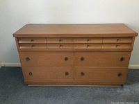 Front view photo of the vintage Kroehler veneer dresser showing six drawers, wood veneer finish, and drawer pulls.