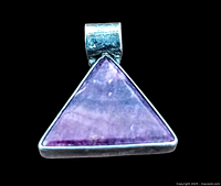 Front view of triangular ruby zoisite pendant set in sterling silver showing stone color and bail