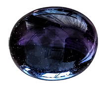Close-up of the polished oval purple amethyst cabochon gemstone showing glossy finish and internal color variations.