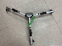Top-down view of the Inwood tripod dolly showing the three legs, caster wheels, and central handle with brand label.