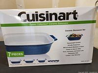 Box front showing Cuisinart Classic Collection Ceramic Bakeware 7-piece set with blue and white ceramic pieces.