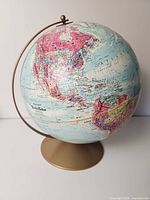 Front view of Replogle World Nation Series globe showing North and South America, Atlantic Ocean, and part of Europe and Africa.