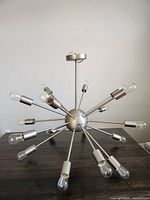 Full view of Sputnik pendant light showing all arms and bulbs.