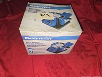 Original box of Mastercraft multi-purpose electric sharpener showing product image and features.