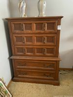 Front view of entire dresser showing 2 small over 2 large drawers and metal handles