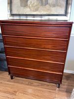 Front view of the dresser showing five drawers and integrated groove handles