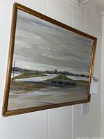 Full view of the framed 13x17 landscape painting featuring a river, bridge, and distant hills under a cloudy sky.