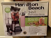 Photo of the Hamilton Beach blender box showing product details and included parts.
