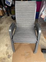 Stackable metal base patio chair with grey mesh fabric seating
