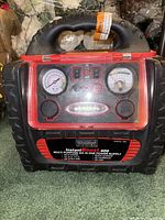 Front view of Mobile Power Instant Boost 400 power supply showing gauges, switches, handle, and branding.