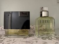 Two cologne bottles: Gucci Envy and Calvin Klein Eternity for Men
