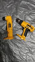 Photo showing two DeWalt cordless drills: a standard drill and a right-angle drill, both without batteries or chargers.