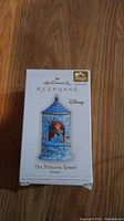 Box of the Hallmark Keepsake Magic Disney ornament The Princess Tower showing branding and product name.