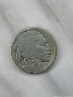 Front (obverse) side of 1918 USA Buffalo nickel showing the Native American profile with wear typical to AG condition.