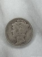 Front view of 1942 Mercury Dime showing winged Liberty Head and inscriptions.