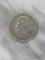 Obverse side of the 1960 Franklin silver half dollar coin showing Benjamin Franklin's profile and inscriptions including LIBERTY, IN GOD WE TRUST, and the year 1960.