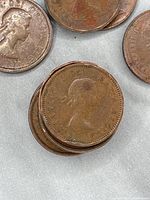 Coins showing Queen Elizabeth II on the obverse with visible wear.
