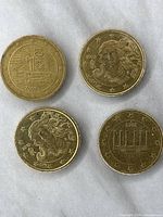 Four Italy 10 Euro Cent coins showing obverse sides with Italia goddess design from 2002 and 2008