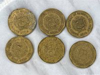 Obverse side of six Peru 20 Centimos coins showing the Peruvian coat of arms and year of minting ranging from 2009 to 2018.