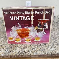 Box showing 26-piece party starter punch set by Anchor Hocking in vintage style