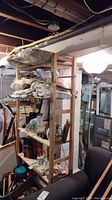 Full view of IKEA wooden shelving unit in basement filled with items (not included)