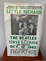 Full view of the rock concert poster showing Little Richard and The Beatles with event details.