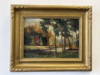 Front view of the antique gilt framed oil painting showing the landscape artwork and artist signature.