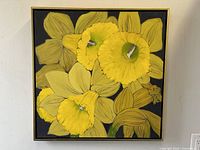 Frontal view of square canvas painting showing yellow daffodils on black background within gold frame