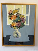 Full view of the impressionist floral still life oil painting in wooden frame.
