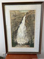 Front view of the framed sumi-e waterfall painting showing full image with framing and mat.