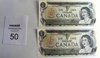 Two stacked Canadian $1 bills side by side with serial numbers visible, and auction lot card with number 50.
