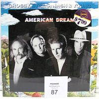 Front cover of sealed vinyl LP American Dream by Crosby, Stills, Nash & Young showing band members, album title, and price sticker.