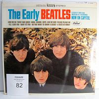 Front cover of The Early Beatles vinyl LP sealed with minor corner damage.