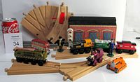 Wooden Thomas the Tank Engine and Friends trains and vehicles on wooden train tracks including rare splitter track, shed building, figures, and bus.