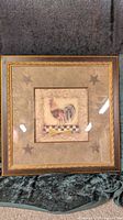 Front view of framed farmhouse style rooster picture with stars on matte