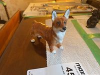 Side view of the Royal Doulton Welsh Corgi figurine showing dog standing with brown and white paint.