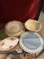 Overview of all five collectible china items including plates and bowls from Wedgwood, J&G Meakin, Hampton, Royal Standard