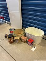 Group photo of all vintage metal items including laundry tub, metal pot, and assorted tins
