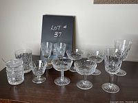 Full overview of all ten crystal items on wooden surface