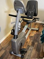 Side view of the Vision Fitness semi-recumbent exercise bike showing the seat, pedals, and console area.