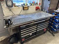 Front view of entire unit including table top, toolbox, vise