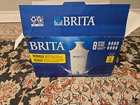 Damaged blue Brita box showing it contained 8 water filter cartridges