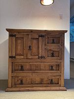 Front view showing two-door upper cabinet and four drawers below