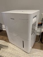 Front and side view of unit showing overall condition and water tank window