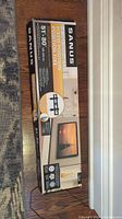 Packaged Sanus Fixed-Position TV Wall Mount box showing dimensions 51-80 inches and brand name.