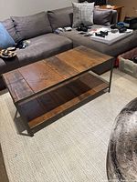 Front view of rectangular reclaimed wood top and lower shelf