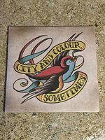 Front cover of City and Colour Sometimes vinyl record with tattoo-style bird and banner artwork.