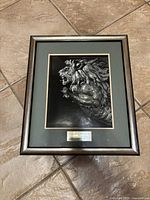 Framed signed black and white photograph with plaque visible