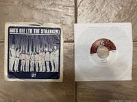 Lighthouse vinyl record with 'Hats Off (To The Stranger)' single sleeve and record on floor.
